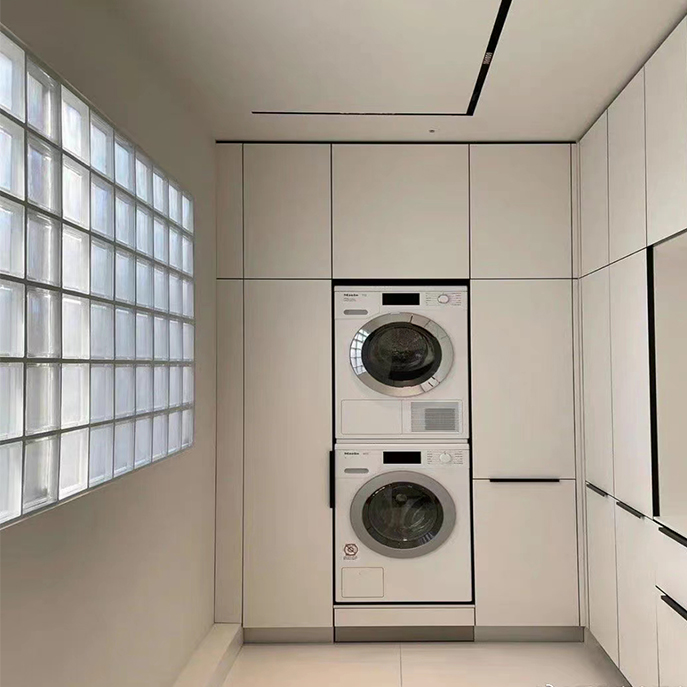 Modern style white laundry room cabinets