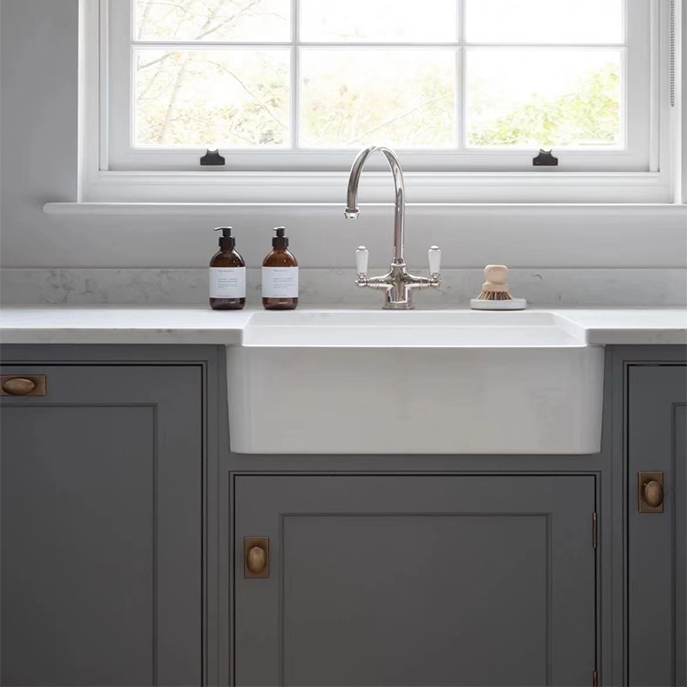 Dove gray shaker style door laundry room cabinets